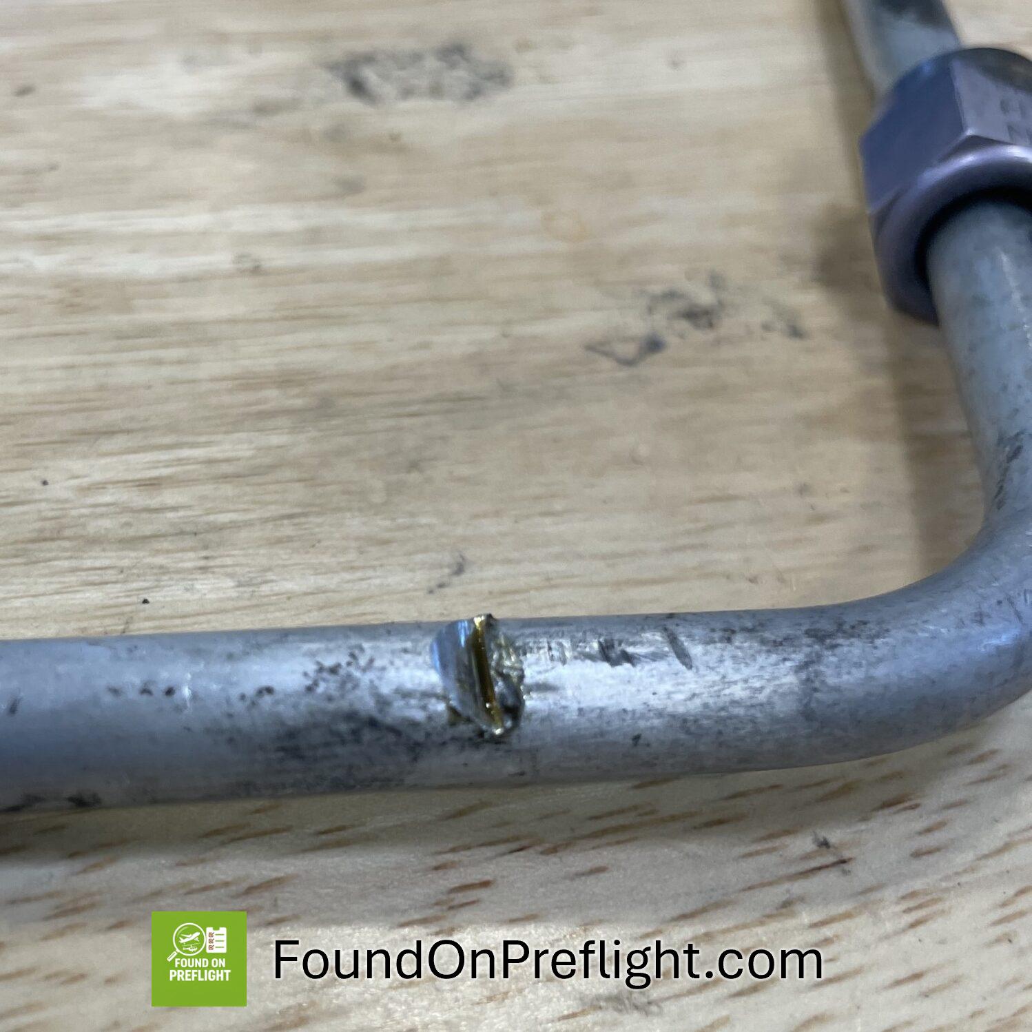R22 engine oil line cut through but sheet metal rubbing against it