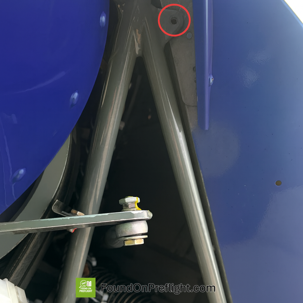 R22 missing screw that connects fuselage frame and sheet metal