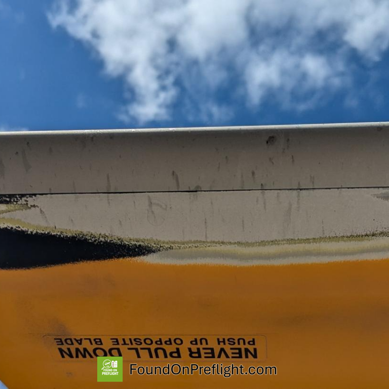 R22 main rotor bond line exposed