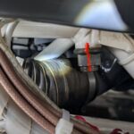 R44 main rotor gearbox cooling hose rubbing into white steel frame