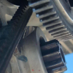 R22 - Alternator belt rubbing on starter motor case