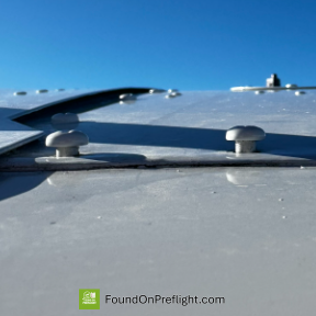 C172 - Screws appear loose on upper wing near fuselage