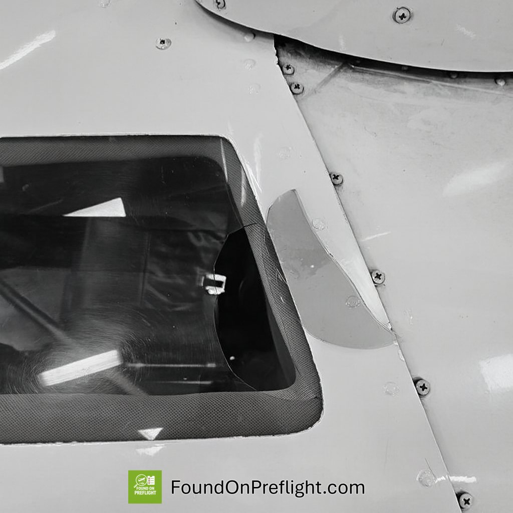 R22 broken window above left seat